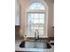 Kitchen sink with granite countertop and view of backyard at 5105 Chelsey Ln, Monroe, NC 28110