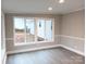 Sunroom with multiple windows and grey flooring at 5105 Chelsey Ln, Monroe, NC 28110