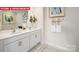 Double vanity bathroom with hexagon tile floor and large mirror at 513 Zermatt Ct, Monroe, NC 28112