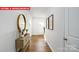 Light-filled hallway with wood floors and decor at 513 Zermatt Ct, Monroe, NC 28112