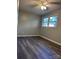 Bedroom featuring vinyl flooring, neutral walls, and a ceiling fan at 526 Kings Rd, Shelby, NC 28150