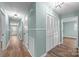 Bright hallway with hardwood floors and neutral-colored walls at 1251 Magnolia St, Albemarle, NC 28001