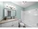 Updated bathroom with white cabinets, granite countertop, and a bathtub at 1251 Magnolia St, Albemarle, NC 28001