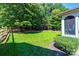 Landscaped backyard with a wooden fence and lush greenery at 3905 Granite St, Terrell, NC 28682