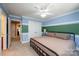 Bright bedroom with double doors leading to a full bathroom and hallway at 3905 Granite St, Terrell, NC 28682