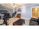 Spacious bonus room with home gym equipment and media setup at 3905 Granite St, Terrell, NC 28682