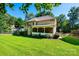 Two-story house with a screened porch and well-maintained lawn at 3905 Granite St, Terrell, NC 28682