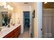 Clean bathroom with double sinks and access to bedroom at 3905 Granite St, Terrell, NC 28682
