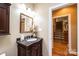 Stylish bathroom with granite vanity, view into hallway and stairs at 3905 Granite St, Terrell, NC 28682