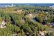 Aerial view of waterfront property with lush greenery and neighboring houses at 3905 Granite St, Terrell, NC 28682