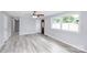 Spacious living room with light gray walls and wood-look vinyl flooring at 1613 Ohenry Ln, Fort Mill, SC 29708