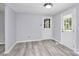 Dining area with wood-look flooring and access to a back patio at 1613 Ohenry Ln, Fort Mill, SC 29708