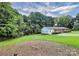 Brick ranch house with a large yard and trees at 1613 Ohenry Ln, Fort Mill, SC 29708