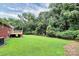 Large backyard with green grass and wooded area at 1613 Ohenry Ln, Fort Mill, SC 29708