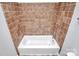 Clean bathroom with brown tile surround and vinyl flooring at 1613 Ohenry Ln, Fort Mill, SC 29708
