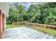 Wooden deck overlooking a wooded backyard at 1613 Ohenry Ln, Fort Mill, SC 29708