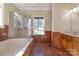 Bathroom boasts a soaking tub, shower, and double vanity at 2101 Congress Ct, Kannapolis, NC 28083