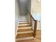 Wooden staircase with black metal balusters at 1018 Cross Creek Dr, Oakboro, NC 28129