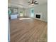 Spacious living room with hardwood floors and fireplace at 1018 Cross Creek Dr, Oakboro, NC 28129