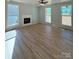 Bright living room with hardwood floors and large windows at 1018 Cross Creek Dr, Oakboro, NC 28129