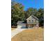 Two-story brick home with a covered porch and attached garage at 1018 Cross Creek Dr, Oakboro, NC 28129