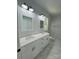 Luxurious bathroom with double vanity, marble shower, and modern lighting at 1018 Cross Creek Dr, Oakboro, NC 28129