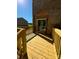 Newly built home features a spacious wooden deck with railings at 1018 Cross Creek Dr, Oakboro, NC 28129
