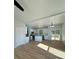 Open concept kitchen with white cabinets, island, and stainless steel appliances at 1018 Cross Creek Dr, Oakboro, NC 28129