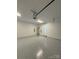 Spacious garage featuring epoxy flooring and extra storage space at 1018 Cross Creek Dr, Oakboro, NC 28129