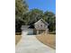 Two-story brick home with a covered porch and attached garage at 1018 Cross Creek Dr, Oakboro, NC 28129