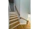 Elegant staircase with wooden treads and a modern handrail at 1018 Cross Creek Dr, Oakboro, NC 28129