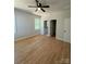 Spacious main bedroom with hardwood floors and en-suite bathroom access at 1018 Cross Creek Dr, Oakboro, NC 28129