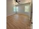 Bright bedroom with hardwood floors and ceiling fan at 1018 Cross Creek Dr, Oakboro, NC 28129
