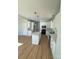 Modern kitchen featuring white cabinets, quartz countertops, and a large island at 1018 Cross Creek Dr, Oakboro, NC 28129