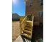 New home features a wooden deck with stairs leading to the backyard at 1018 Cross Creek Dr, Oakboro, NC 28129