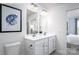 Double vanity bathroom with modern fixtures and mirrors at 107 Jameson Park Dr # 3, Troutman, NC 28166