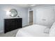 Well-lit bedroom with a large dresser and closet at 107 Jameson Park Dr # 3, Troutman, NC 28166