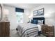 Comfortable bedroom with striped bedding and two nightstands at 107 Jameson Park Dr # 3, Troutman, NC 28166