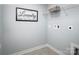 Bright laundry room with shelving and overhead storage at 107 Jameson Park Dr # 3, Troutman, NC 28166