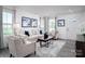 Bright living room with comfy furniture and a neutral color scheme at 107 Jameson Park Dr # 3, Troutman, NC 28166