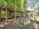 Relaxing outdoor space with a hammock, swing, and brick fire pit at 846 Windy Oaks Way, Lancaster, SC 29720