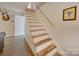 Basement access via a wooden staircase with white risers at 846 Windy Oaks Way, Lancaster, SC 29720