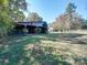 Rustic barn with stalls and string lights at 846 Windy Oaks Way, Lancaster, SC 29720