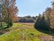 Open lot with tall trees, grassy field and distant tree line at 846 Windy Oaks Way, Lancaster, SC 29720