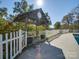 Charming gazebo with white picket fence next to the pool at 846 Windy Oaks Way, Lancaster, SC 29720