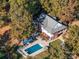 Aerial view showing home, pool, and surrounding trees at 846 Windy Oaks Way, Lancaster, SC 29720