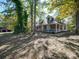 Brick house with metal roof and wrap-around porch at 846 Windy Oaks Way, Lancaster, SC 29720