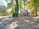 Brick house with metal roof and a wrap around porch at 846 Windy Oaks Way, Lancaster, SC 29720