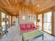 Relaxing sunroom with wicker furniture and tiled floors at 846 Windy Oaks Way, Lancaster, SC 29720