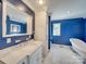 Elegant bathroom with marble vanity, freestanding tub, and blue walls at 846 Windy Oaks Way, Lancaster, SC 29720